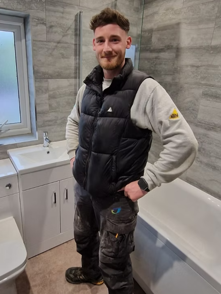 Goldflame engineer routing pipework during a domestic boiler installation.